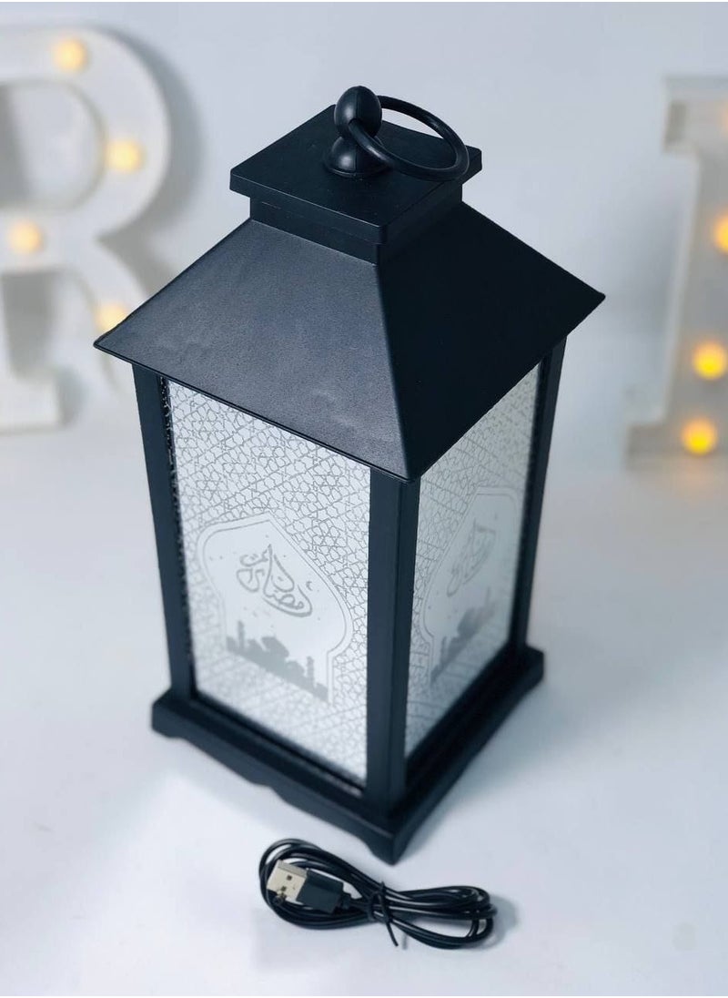 A selection of imported acrylic lanterns, high-quality, clean material in manufacturing. The lantern is made of Ramadan Kareem glass, LED lights, music and Ramadan songs. It works with stones and a USB connection. It has a balloon and a switch to control the direction of the sound and the direction of the light only. The size is 35*16 cm.