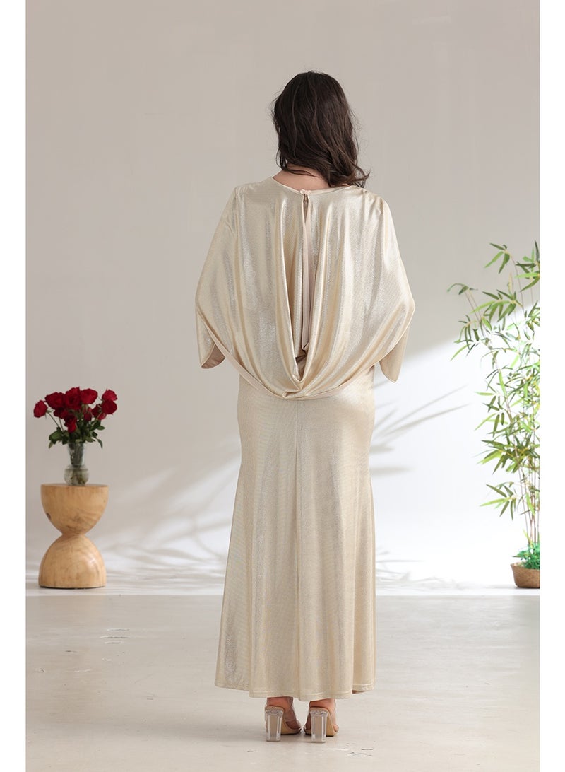 A long champagne-colored evening dress with a wrap silhouette and elegant wide sleeves. - Image 3