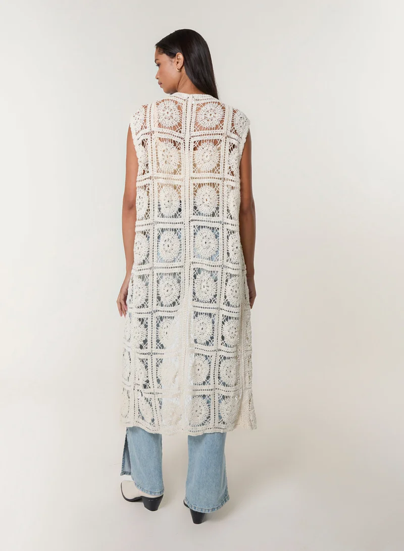 بلو فانيلا كارديجان كروشيه بتفاصيل ربطة أمامية