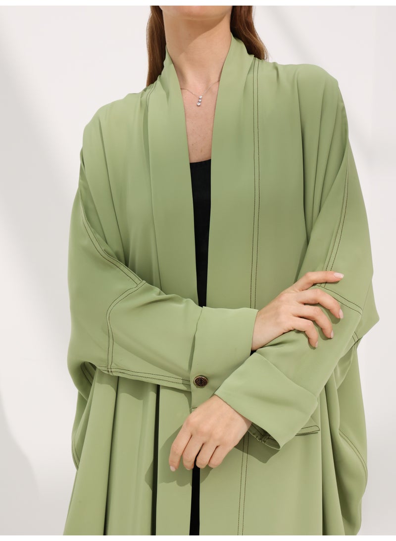 Khan&Co. Seven Seas Matcha matcha green crepe fabric abaya with two gold KHAN&CO logo buttons - by Abdullah Khan - Image 3