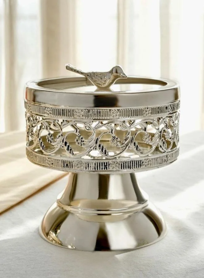 Casa Quesera Add a touch of vintage elegance to your home with this artisan silver-plated bowl, complete with a bird finial and decorative pedestal base. It's perfect for storing small treasures or displaying as a unique centerpiece.