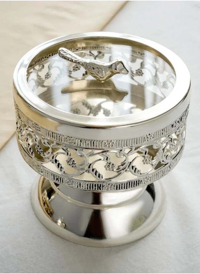 Casa Quesera Add a touch of vintage elegance to your home with this artisan silver-plated bowl, complete with a bird finial and decorative pedestal base. It's perfect for storing small treasures or displaying as a unique centerpiece.