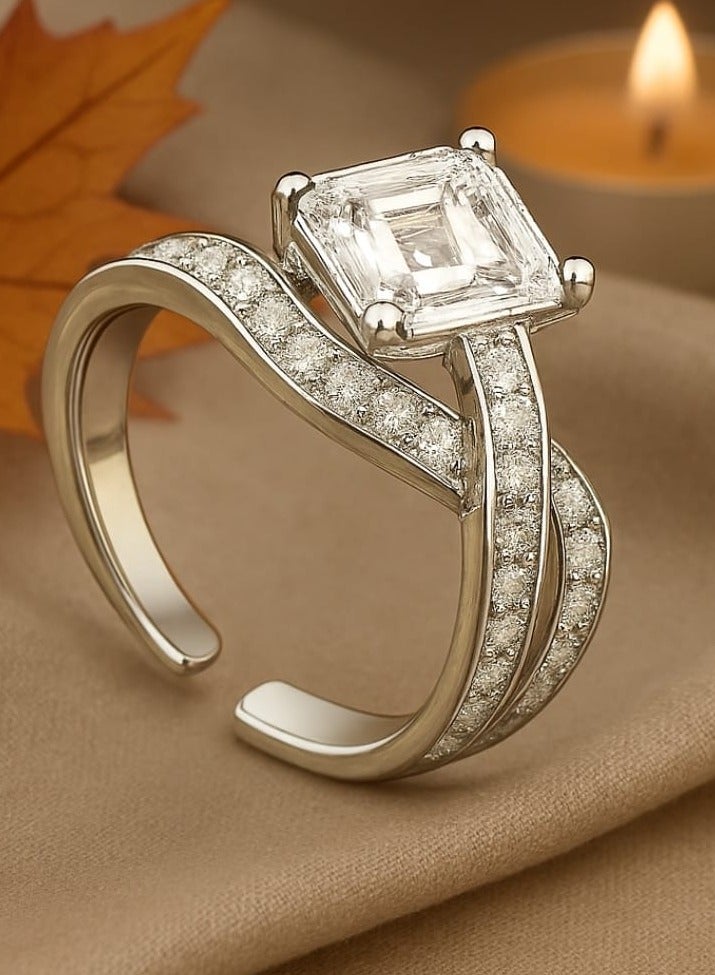 ""Aura of Luxury"" Ring - An Eye-Catching Design Shine an unforgettable look with this luxurious ring, which combines boldness and sophistication. A square-cut center stone sits atop an elegant base, surrounded by intricate details on the band, studded with tiny stones that add a subtle sparkle. Its distinctive design offers the perfect balance between luxury and modernity, making it a standout piece for every occasion." - Image 4