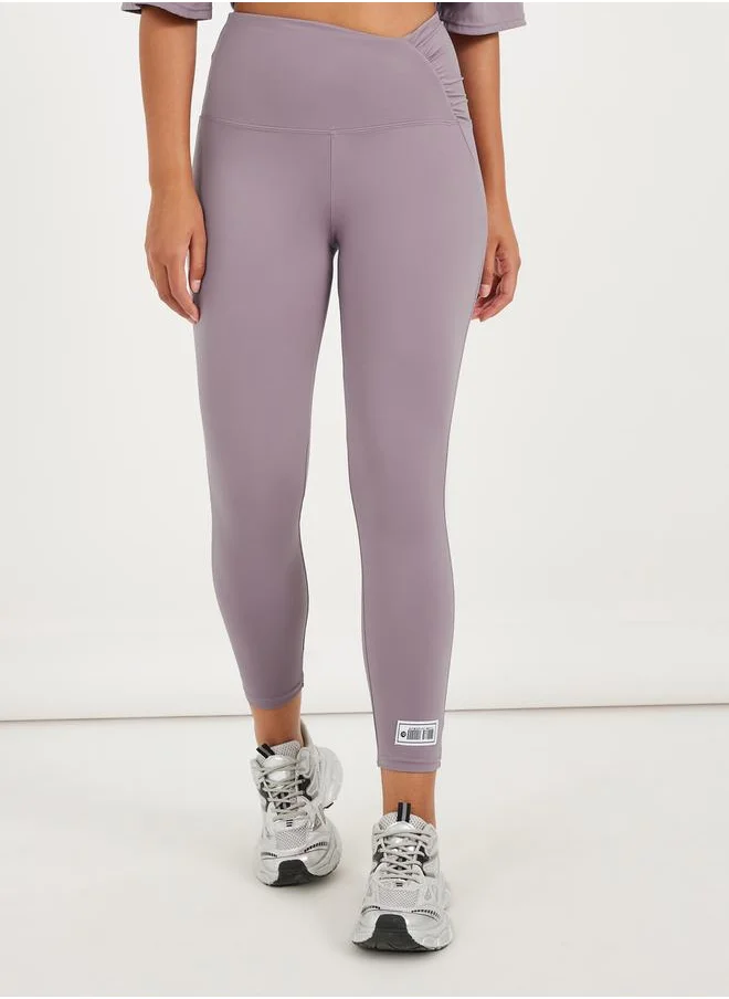 ستايلي Gymspire Edition - Label Ruched Waist 7/8 Leggings