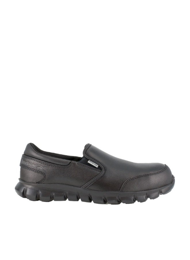 Reebok Work سابلايت كوشن وورك | IB4036 – أسود، حذاء سليب-أون بمقدمة واسعة من كومبوزيت وتوسيد Sublite وراحة MemoryTech وتصميم خفيف غير معدني - Image 1