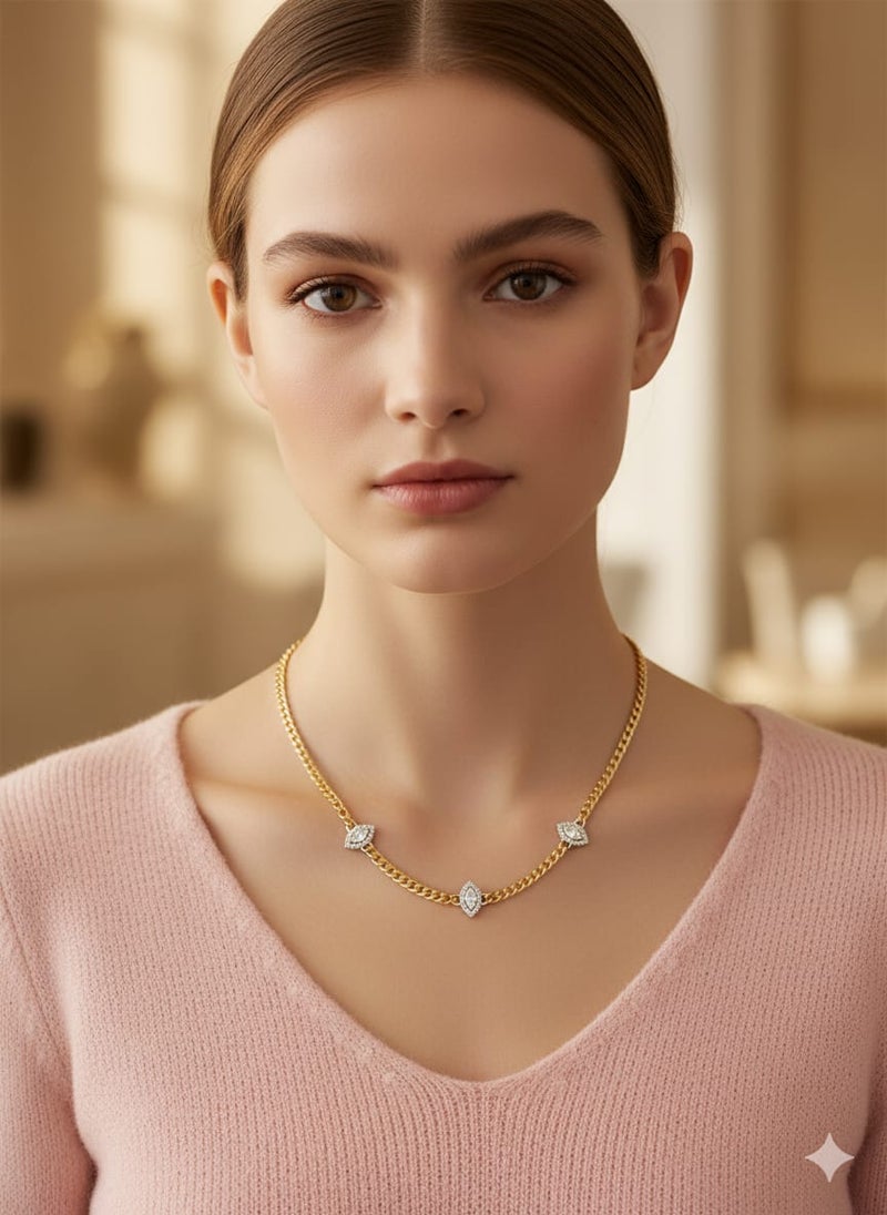 A necklace with a thick, gold-plated chain, punctuated by three oval, almond-shaped or eye-shaped units. A row of shiny rectangular stones - additional links for size adjustment. - Image 2