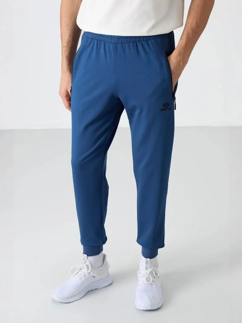 تومي لايف TOMMY Men's Solid Pull-on Sweatpants With Zip Pocket