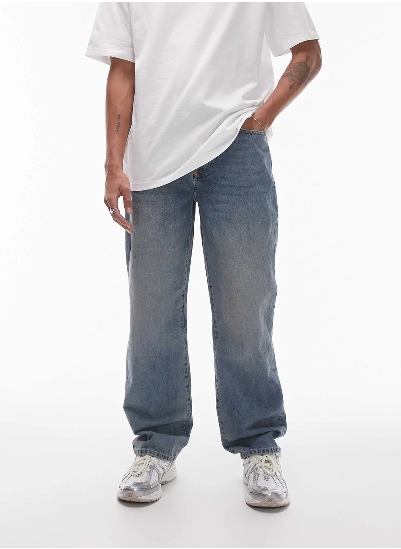 توب مان Light wash relaxed fit Jeans
