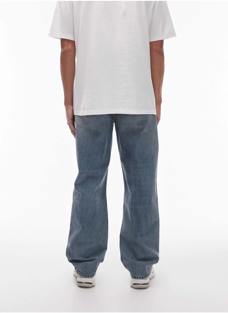 توب مان Light wash relaxed fit Jeans