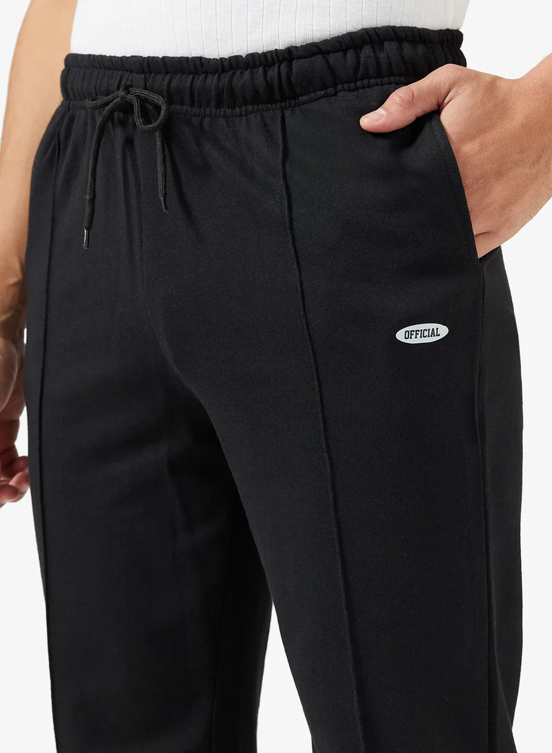 سفنتي فايف بيسيكس بنطال رياضي فضفاض بشعار وفتحة جانبية