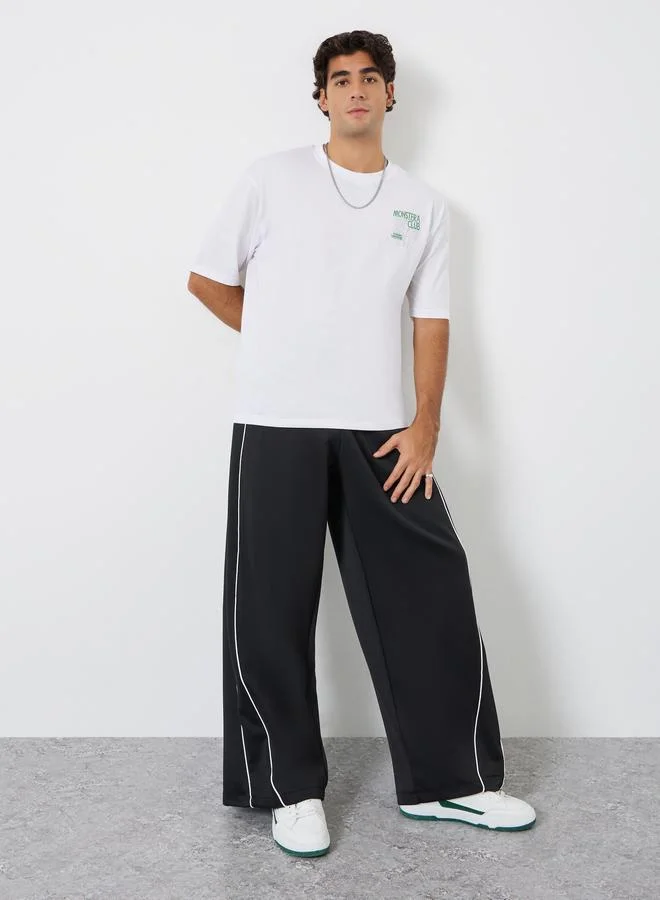 ستايلي تيشيرت جيرسي واسع بطبعة جرافيك