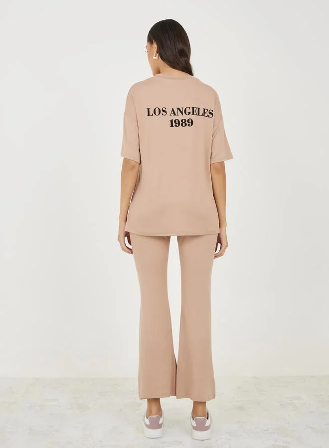Styli Back Slogan Print Oversized T-Shirt & Flared Joggers Co-Ords