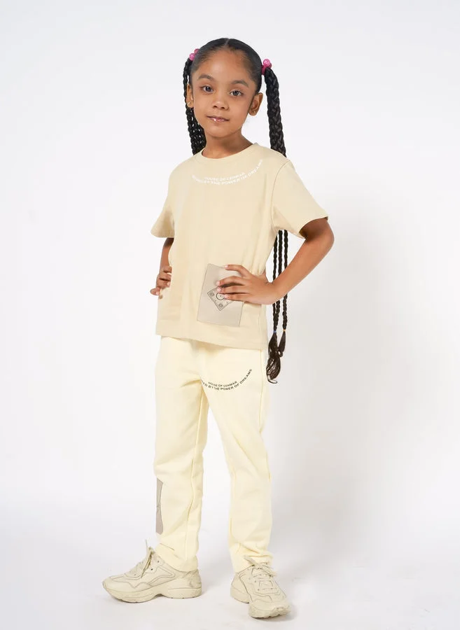 House Of Cenmar Kids Yellow Pants With A Power Of Dreams Print