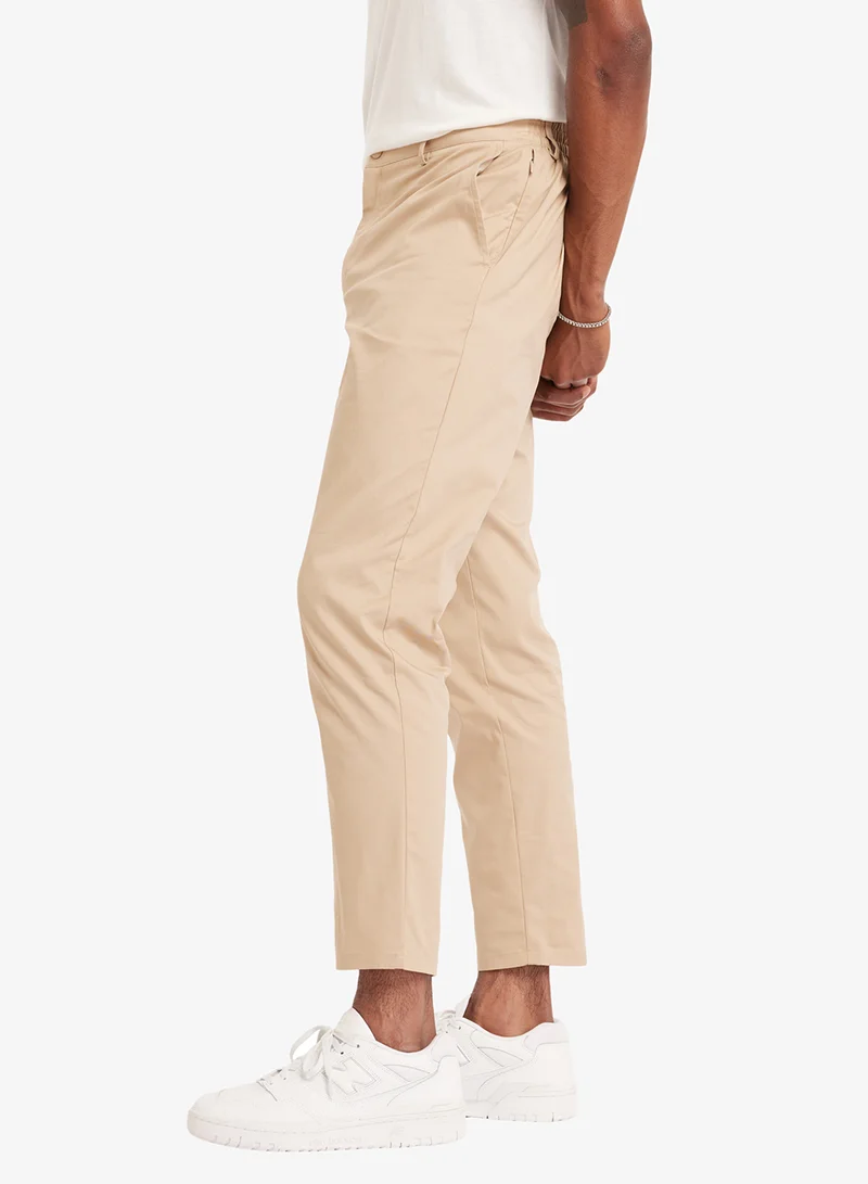 New Balance STONEWARE (SOT) 30" Athletics Standard Tapered Sweatpants for Men | Best Price UAE