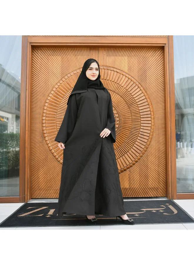 HAWRAA ABAYA Black wrap abaya made of rich fabric decorated with black embroidery and studs at the bottom with a button closure