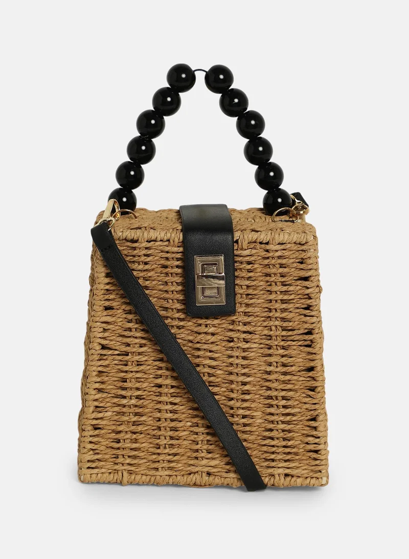 Haute Sauce Colour block Interlock Regular Cane Sling Bag For Women