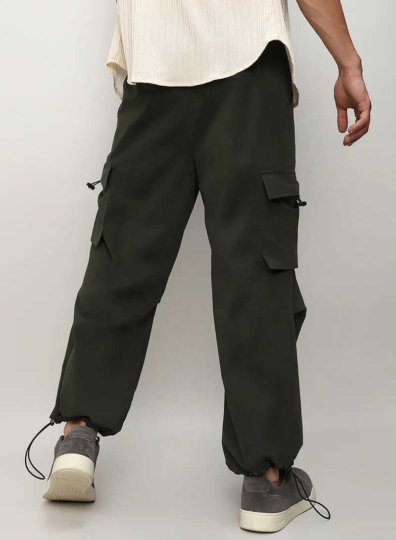 Campus Sutra Men's Forest Green Solid Cargo Parachute Trousers