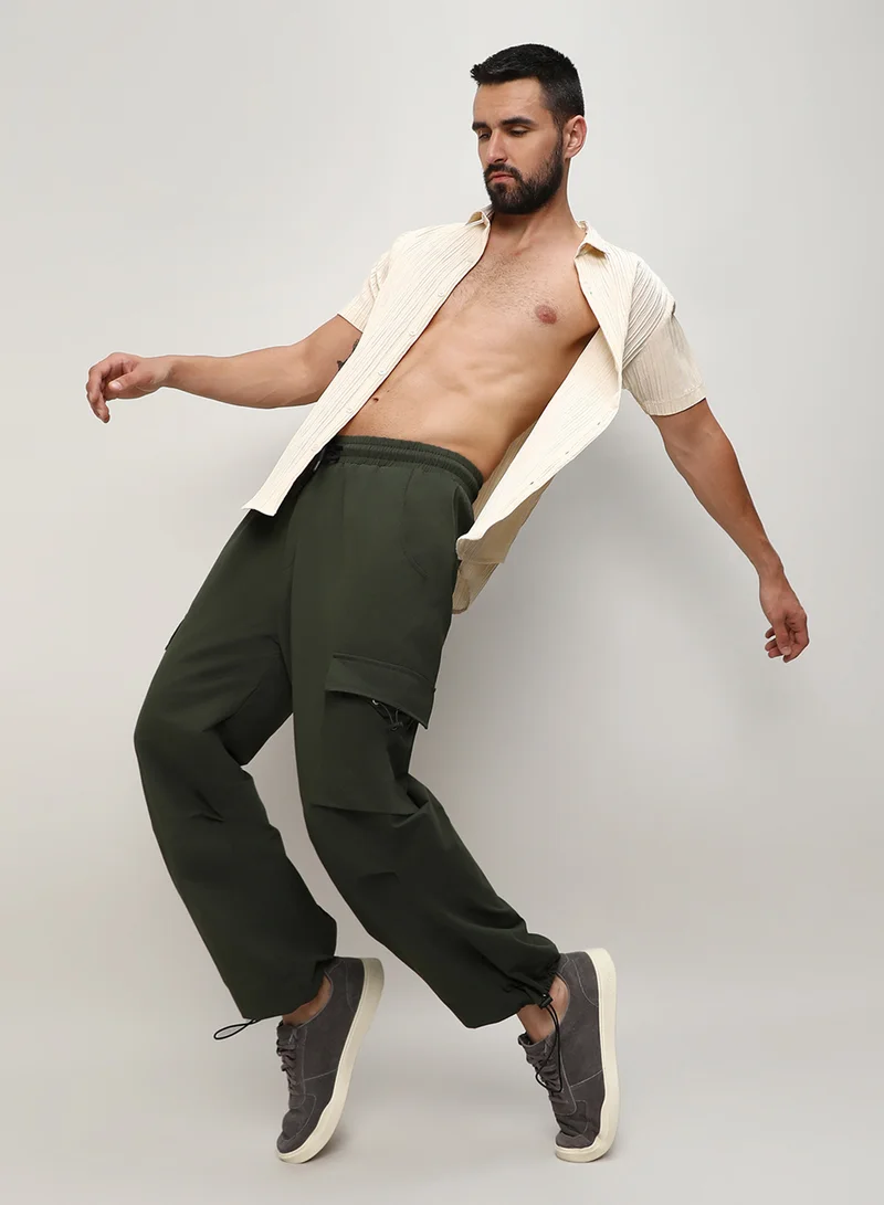 Campus Sutra Men's Forest Green Solid Cargo Parachute Trousers