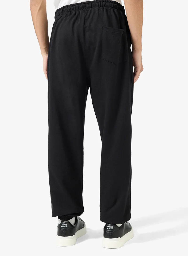 Seventy Five  Badge Detail Oversized Cuffed Joggers for Men | Best Price UAE