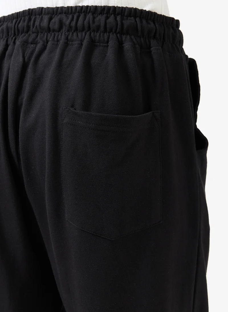 Seventy Five  Badge Detail Oversized Cuffed Joggers for Men | Best Price UAE