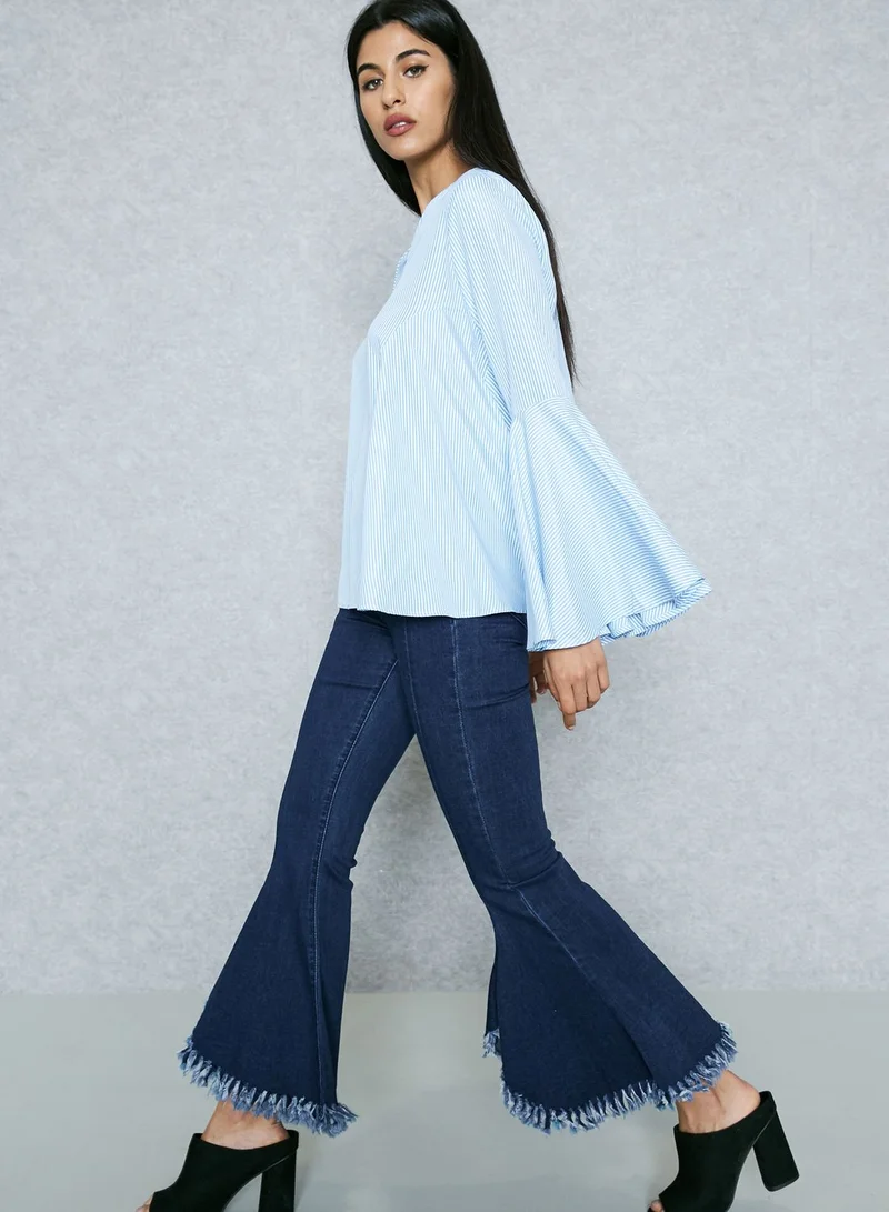 Jovonna London Flared Ripped Hem Jeans