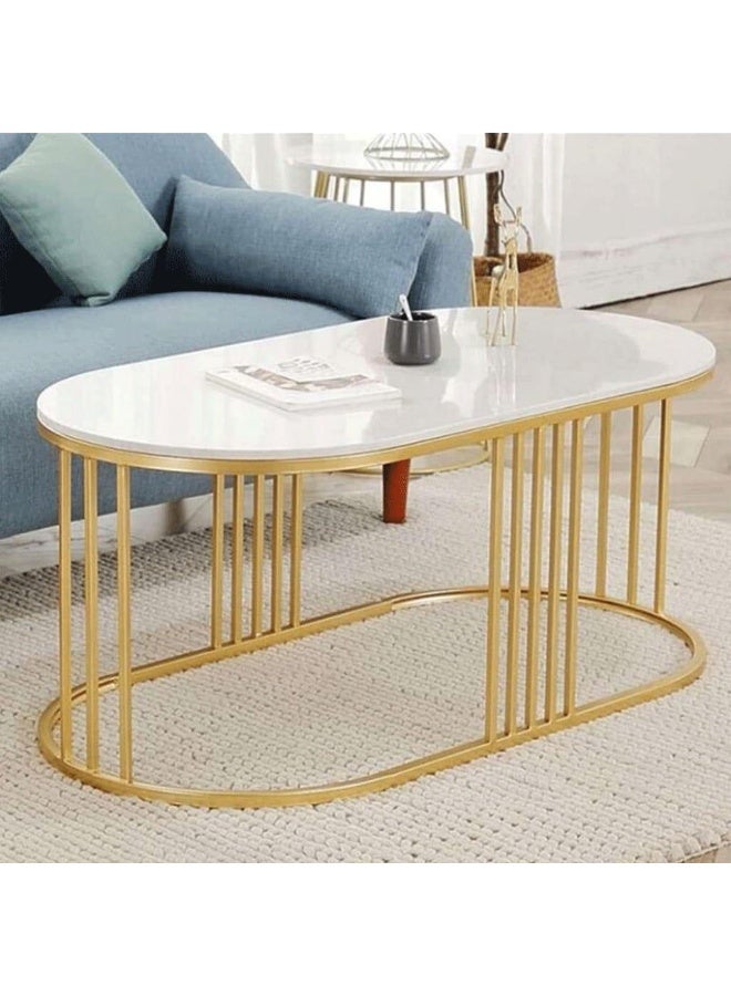 Oval coffee table with golden steel frame and white marble top