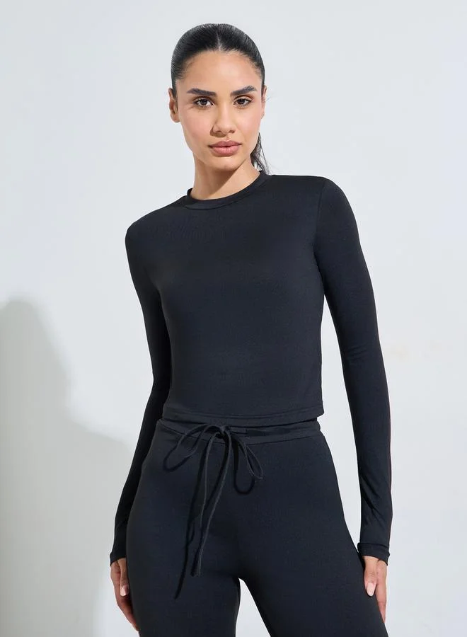 Styli Active  Black Solid Long Sleeves Crop Top And Flared Leggings Active Set for Women | Best Price UAE