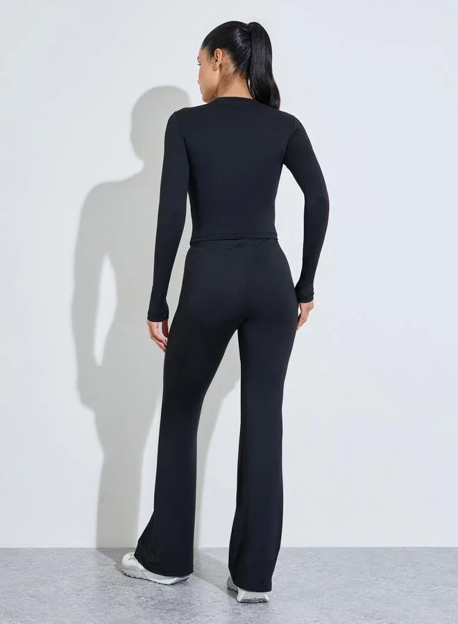 Styli Active  Black Solid Long Sleeves Crop Top And Flared Leggings Active Set for Women | Best Price UAE