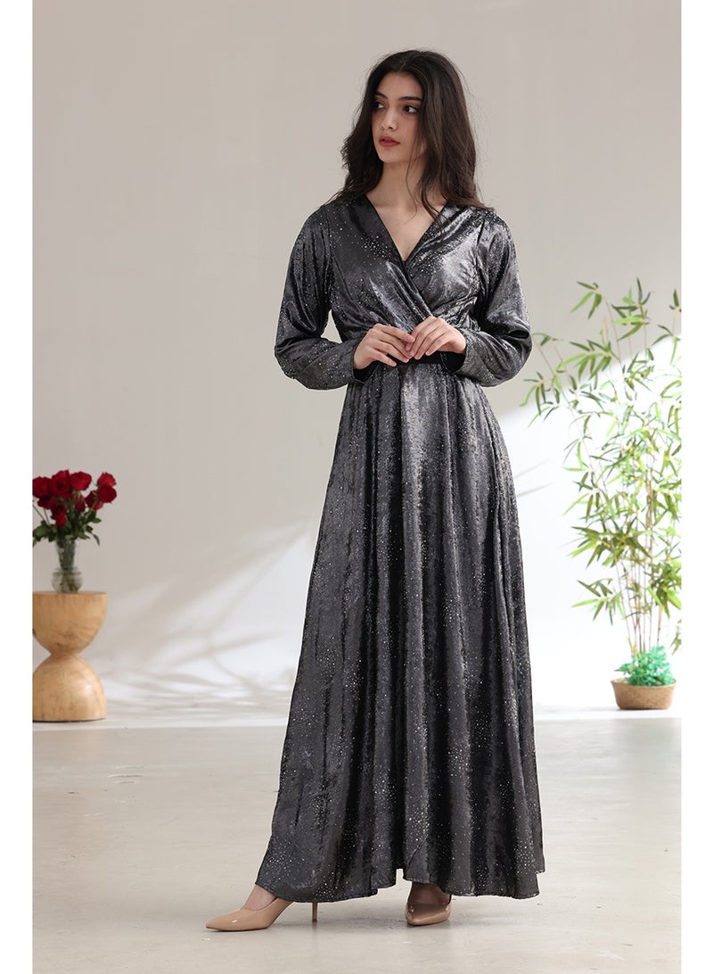 A long, shimmering evening dress with a wrap style and a waist belt. - Image 2