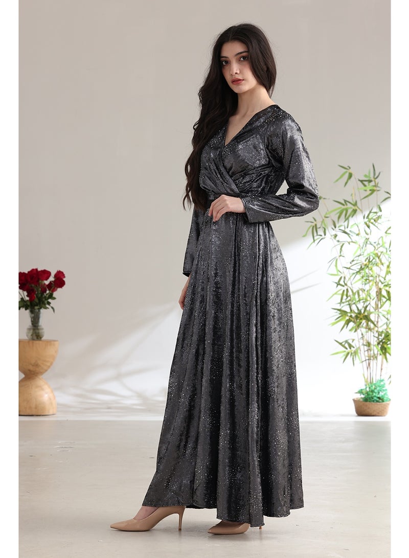 A long, shimmering evening dress with a wrap style and a waist belt. - Image 4