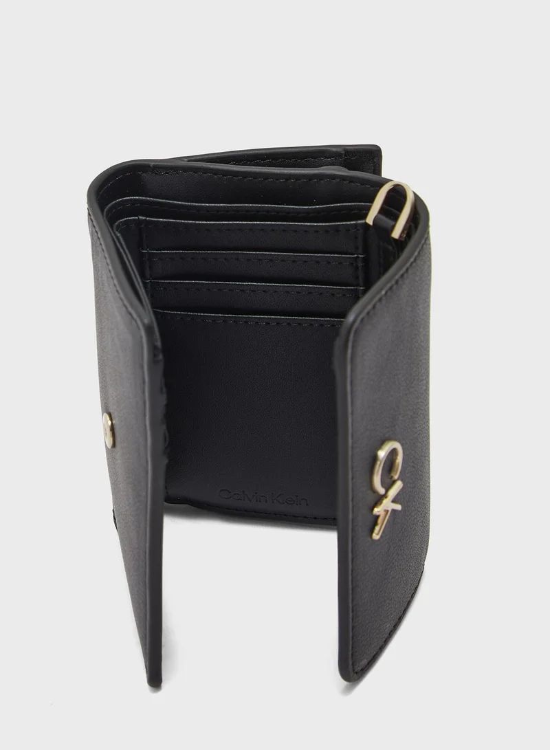 CALVIN KLEIN Reversible Lock Trifold Crossbody Bag