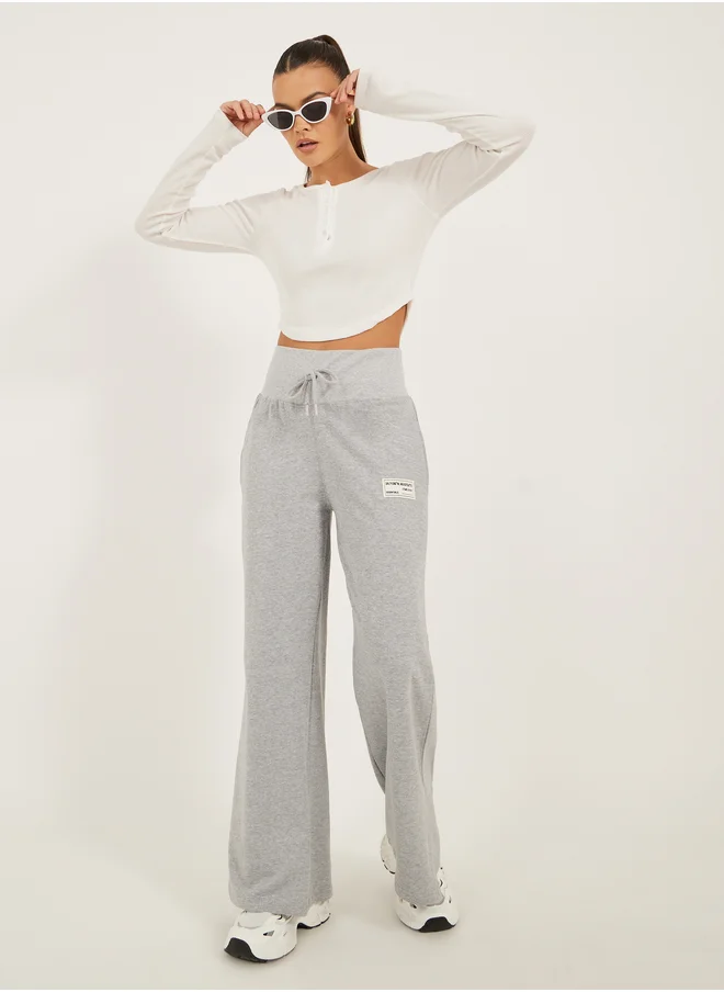 Styli Styli Badge Detail Wide Leg Joggers with Side Slit