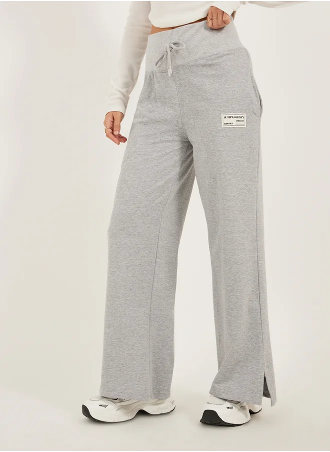 Styli Styli Badge Detail Wide Leg Joggers with Side Slit
