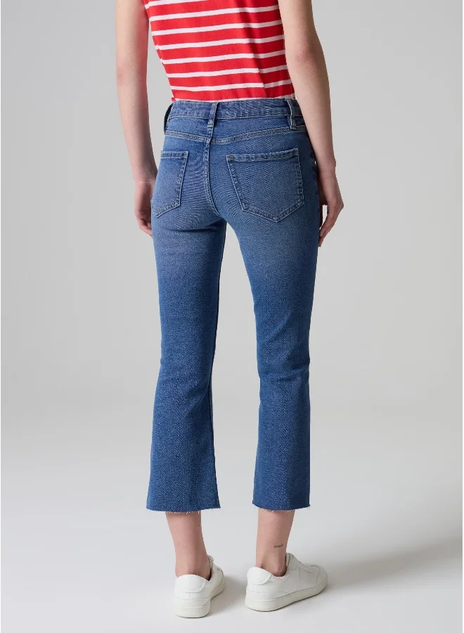 او في اس Flare-fit crop jeans with raw edging