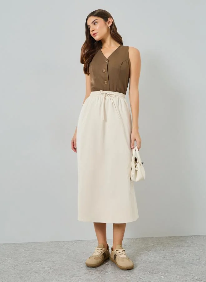 تايك تو تنورة ميدي بكسرات وخصر برباط