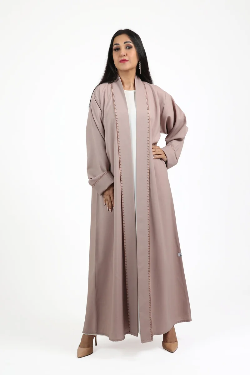 Nikias Overlap barbie fabric abaya with white pipping on sleeves and front