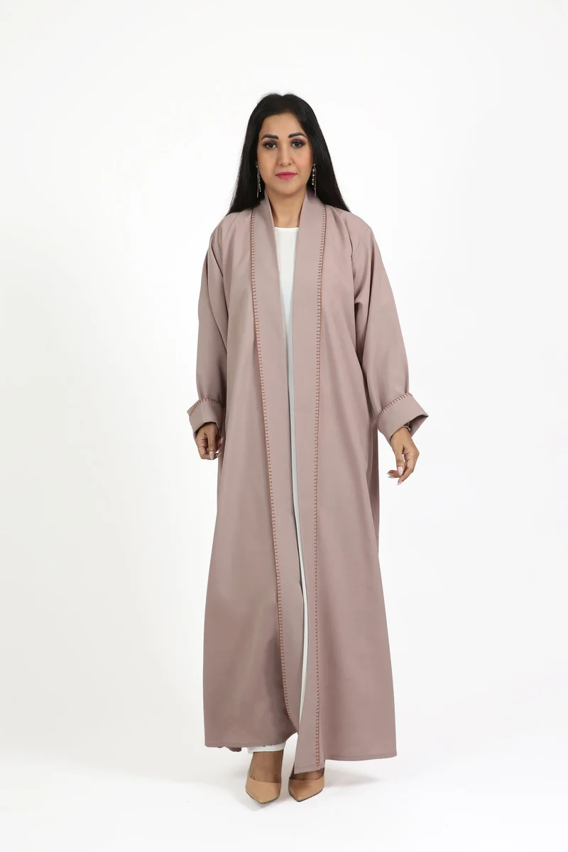 Nikias Overlap barbie fabric abaya with white pipping on sleeves and front