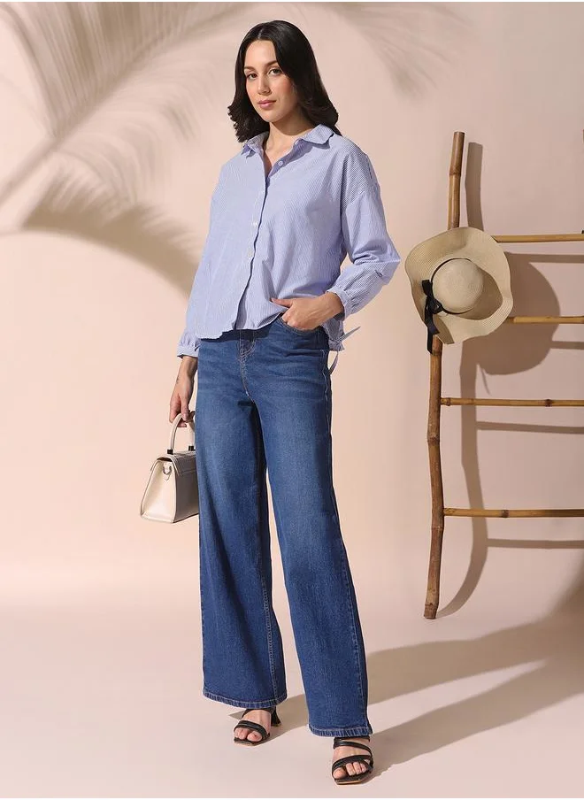 Dennis Lingo Women blue relaxed fit striped full sleeves button down cotton blend shirts with button closure featuring a spread collar- where comfort meets classic charm.