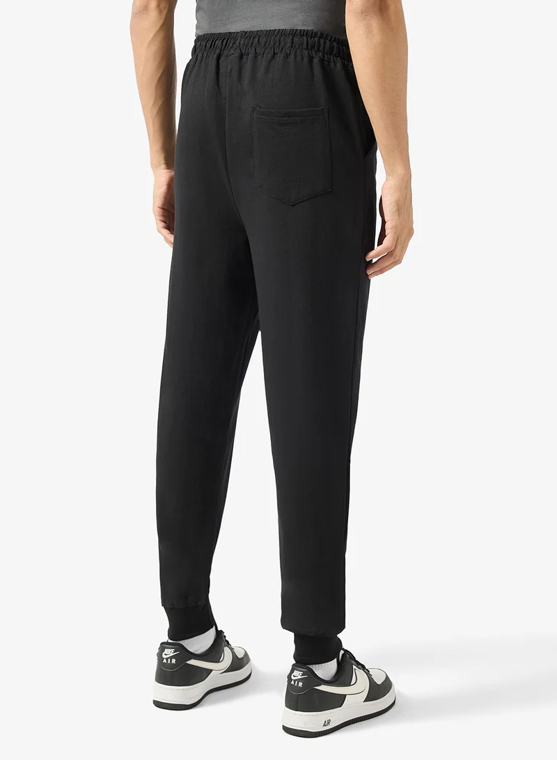 Seventy Five Black Text Print Oversized Joggers for Men | Best Price UAE
