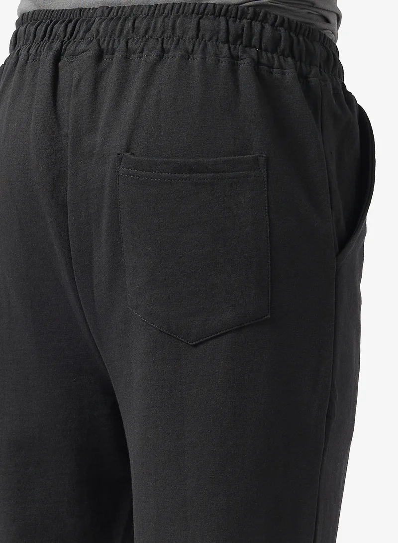 Seventy Five Black Text Print Oversized Joggers for Men | Best Price UAE