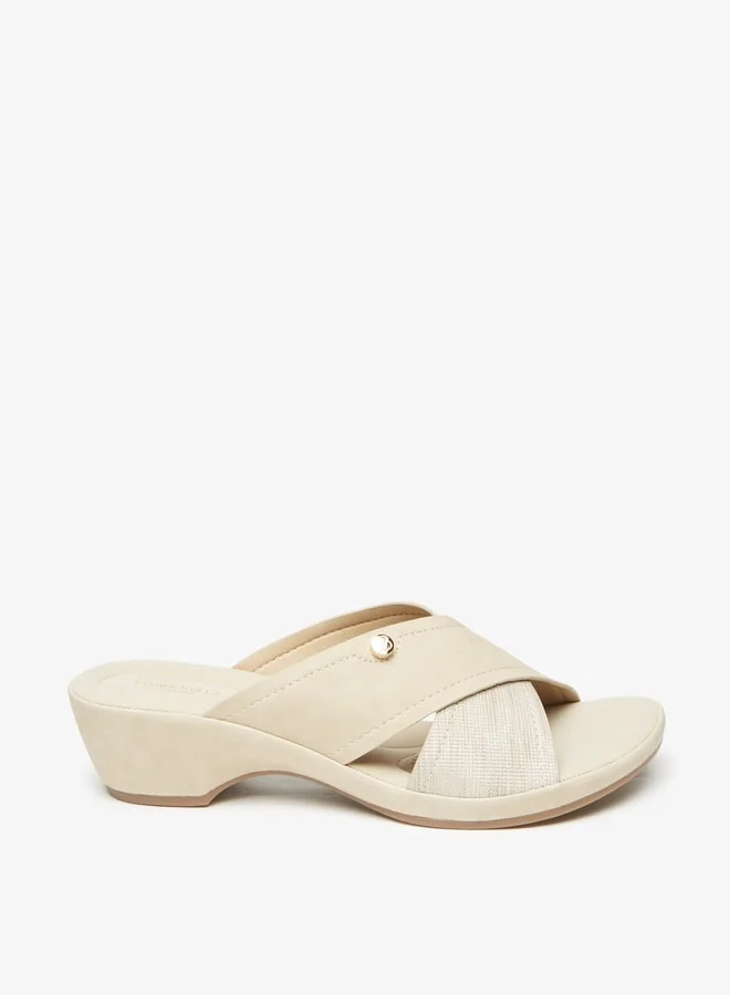 فلورا بيلا من شو إكسبرس Women's Textured Slip-On Cross Strap Sandals with Block Heels