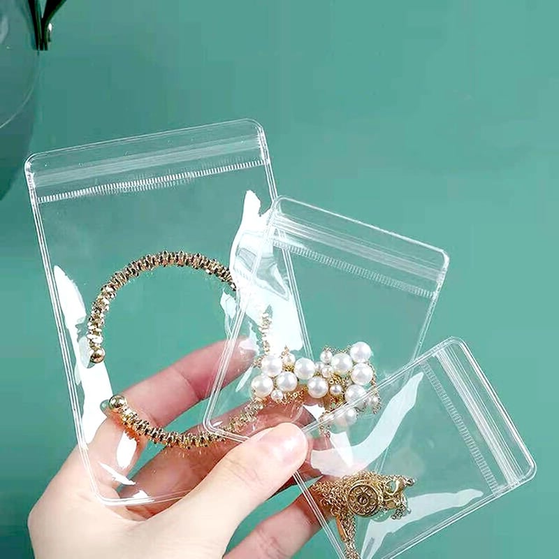 Aeojoor Small Plastic Bags, 100 Pcs Mini Baggies, Clear Plastic Jewelry Thick Self Sealing PVC Bags, Resealable Poly Baggies for Pill, Beads, Screws, Packaging (2x2.8") - Image 1