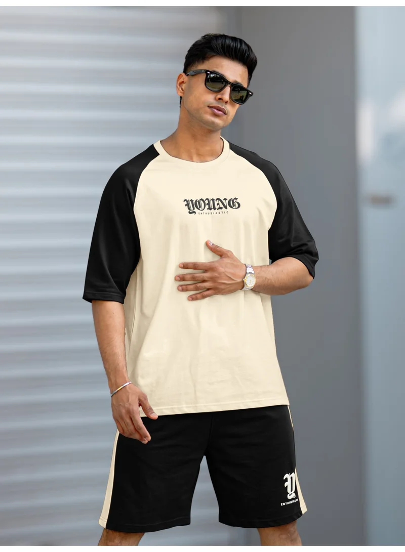 مانياك بدلة رياضية قطنية للرجال بطبعة جنون برقبة دائرية وأكمام نصفية باللون الكريمي والأسود