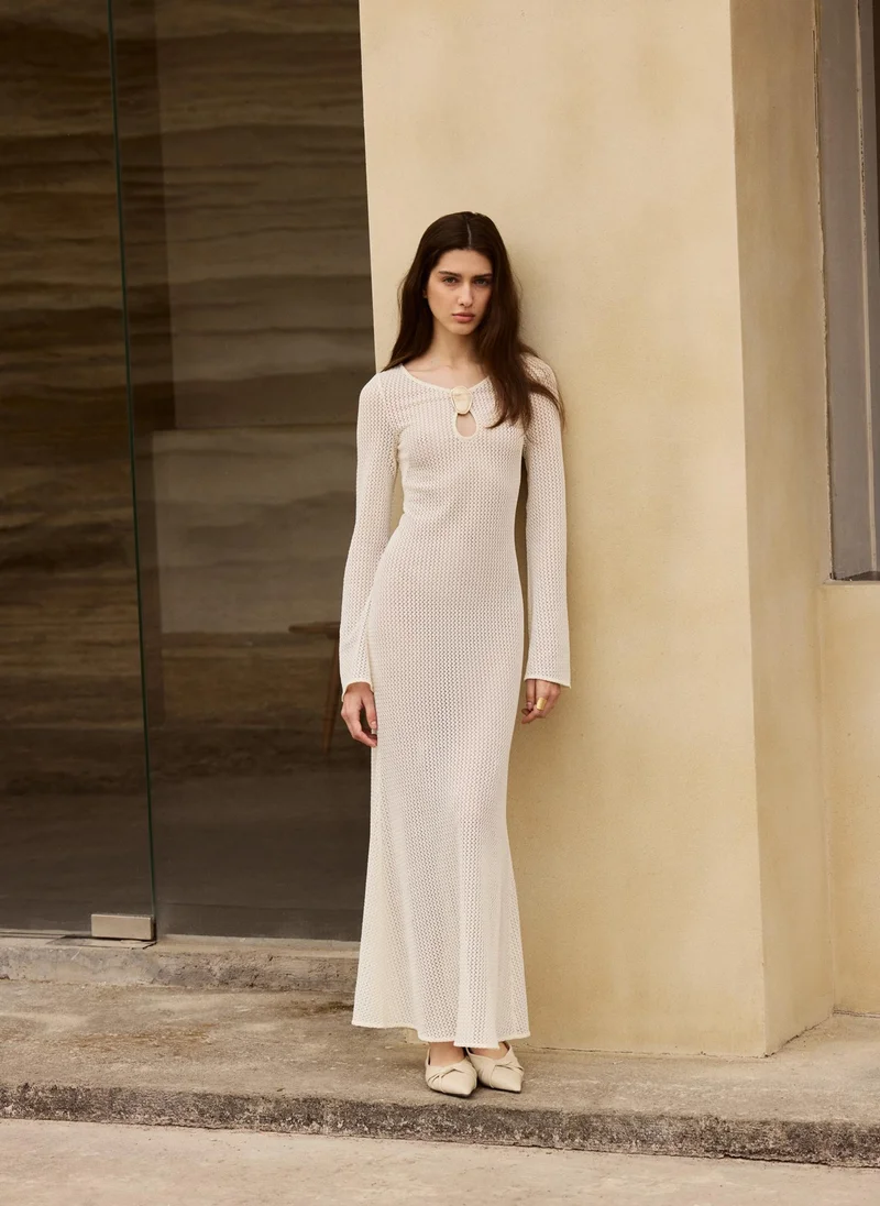 Maxi dress in openwork knit with long sleeves and detailing on the bodice