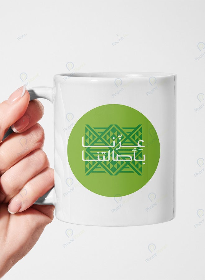 Phone Planet A mug with the phrase Our pride lies in our authenticity printed on it A mug for tea and coffee with a comfortable handle multicolored