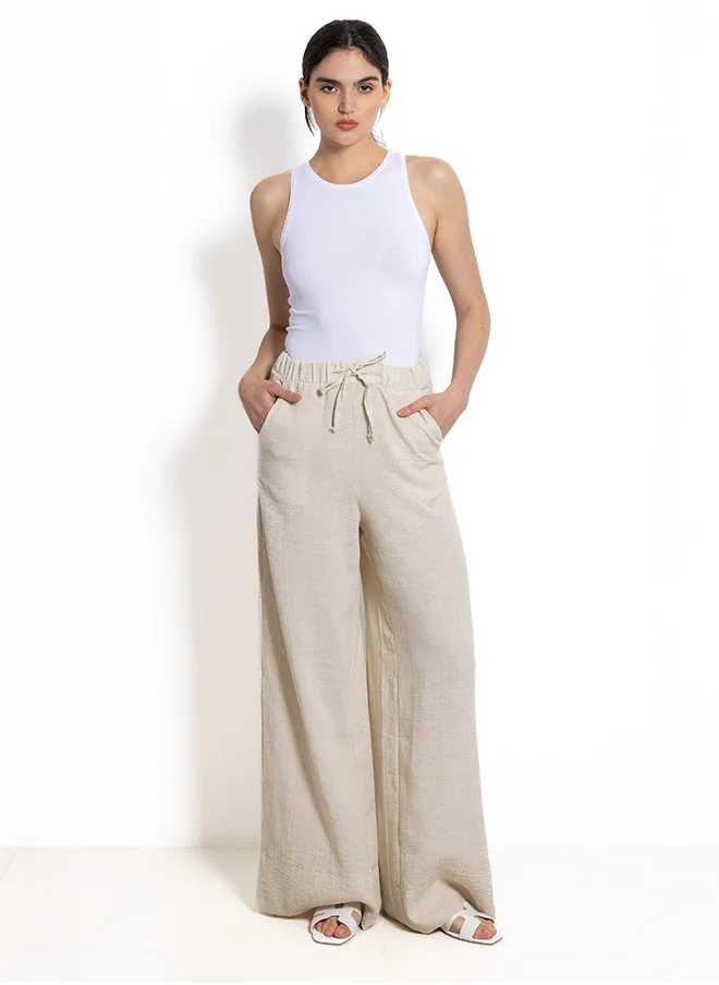 الأشكال   WIDE-LEG LINEN BLEND TROUSERS