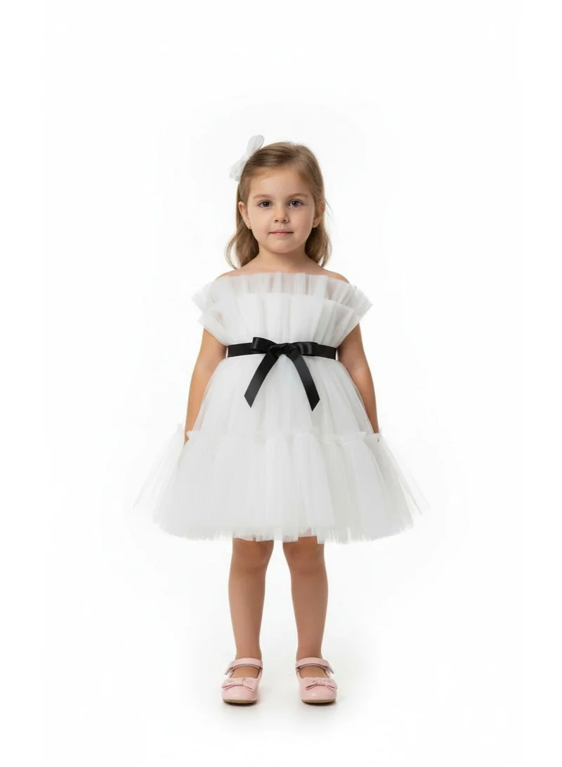 دىدانيالا فستان بناتي بتفاصيل فيونكة وكشكش شبكي أبيض وأسود