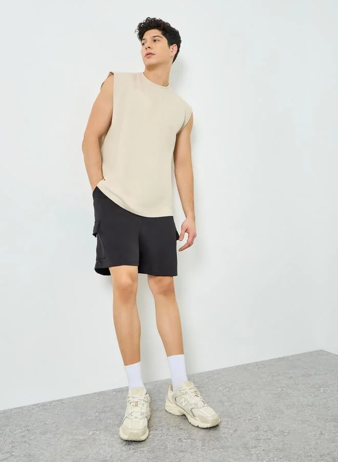 Styli  Men Beige Graphic Print Oversized Tank for Men | Best Price UAE