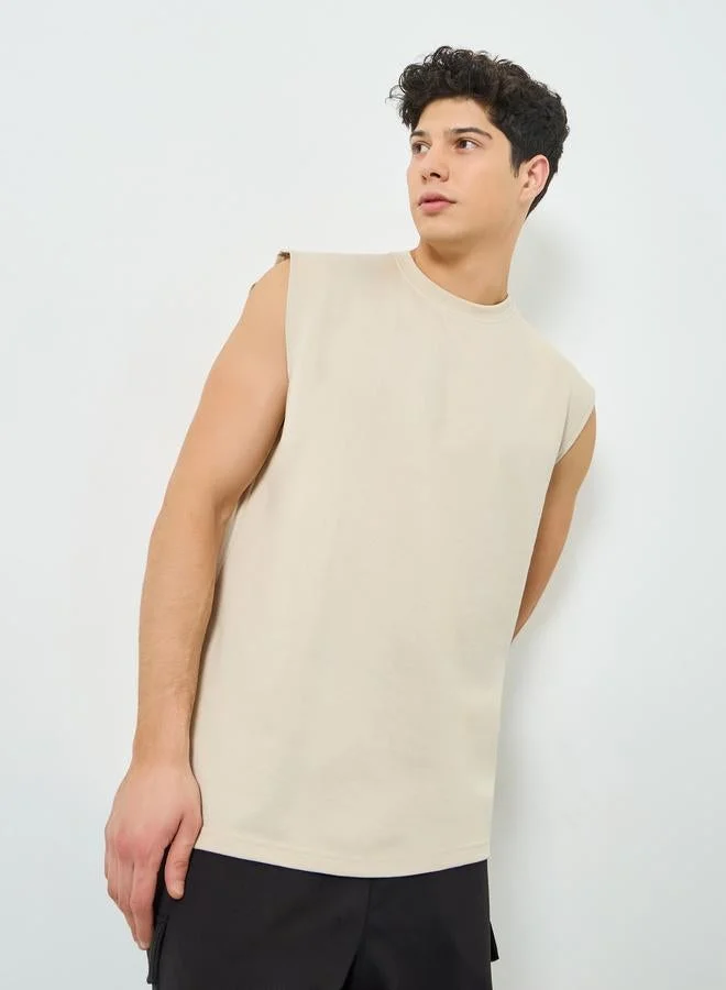Styli Men Beige Graphic Print Oversized Tank