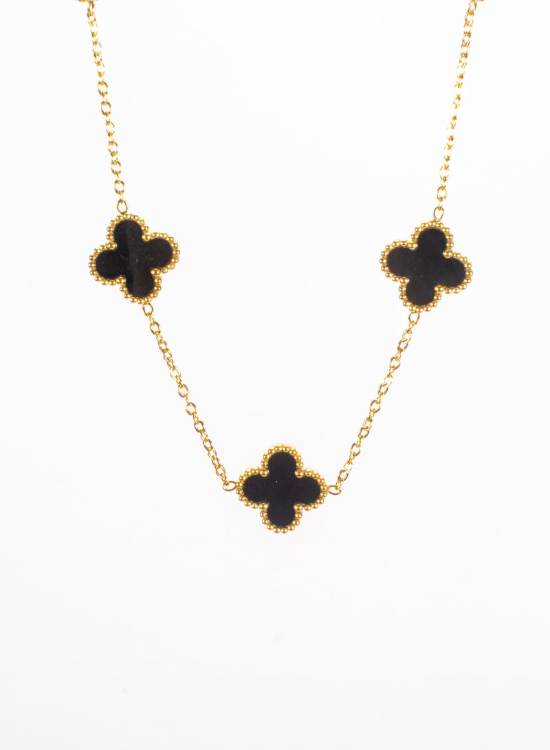 ذا بلاك بيرل اكسسوريز سلسلة أستانليس ستيل ذهبي شكل زهرة البرسيم أسود - Image 1